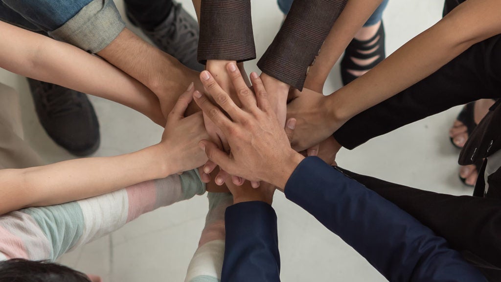 Business Professional success of organization. Successful business team work. The organization of conferences, event ,seminars, Asian worker team. Corporate social responsibility.