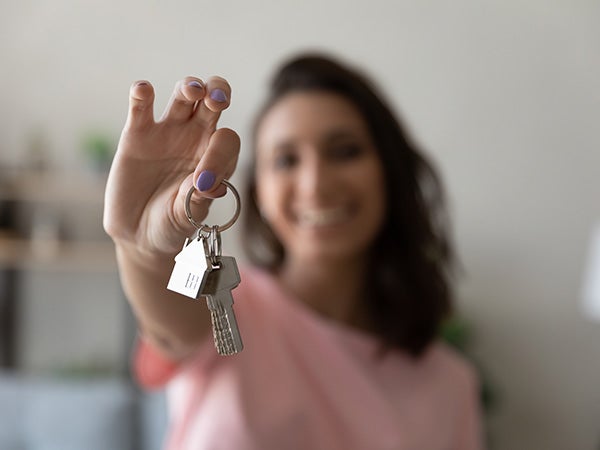 Crop close up of female tenant renter show praise house keys moving to first own new apartment or house, happy woman owner buy purchase home, relocate to dwelling, rental, rent, ownership concept